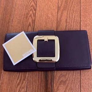 Purple Michael Korda clutch!